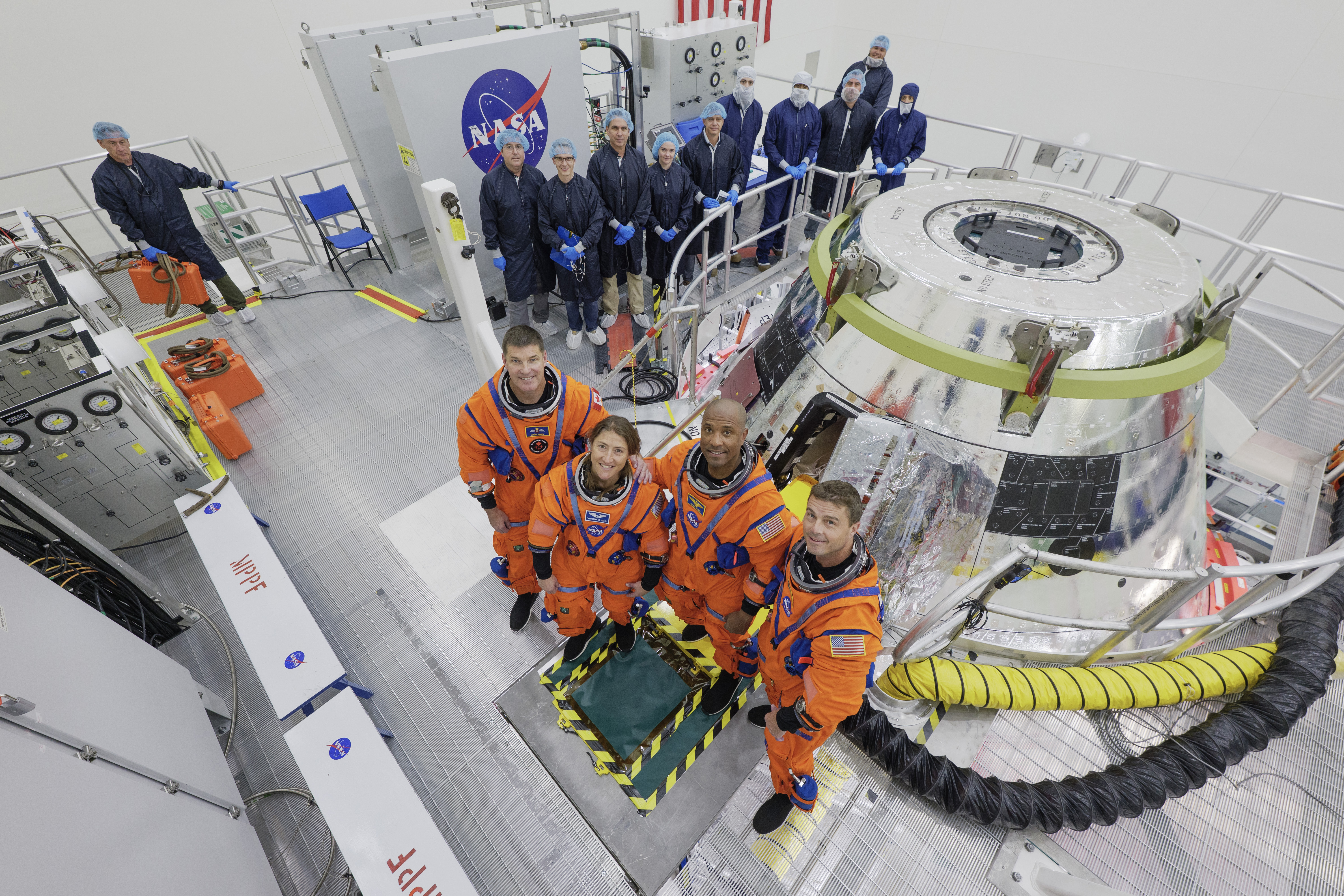 Artemis 2 crew beside Orion capsule