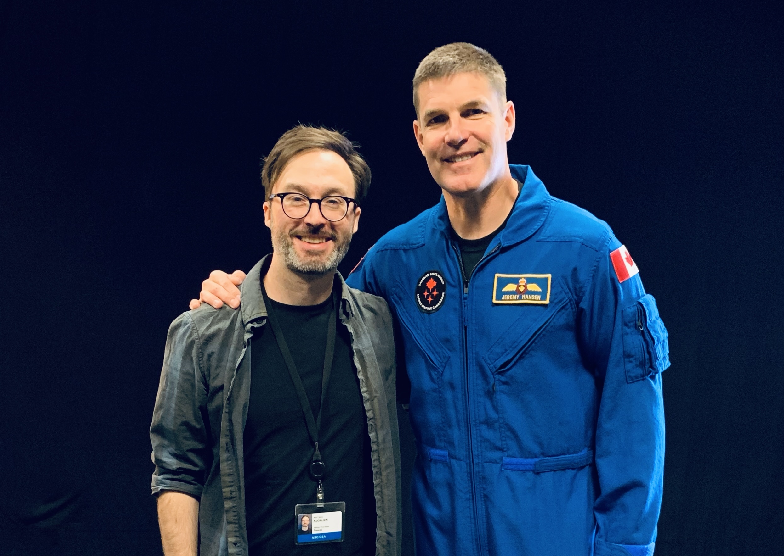Trevor Kjorlien standing with Jeremy Hansen