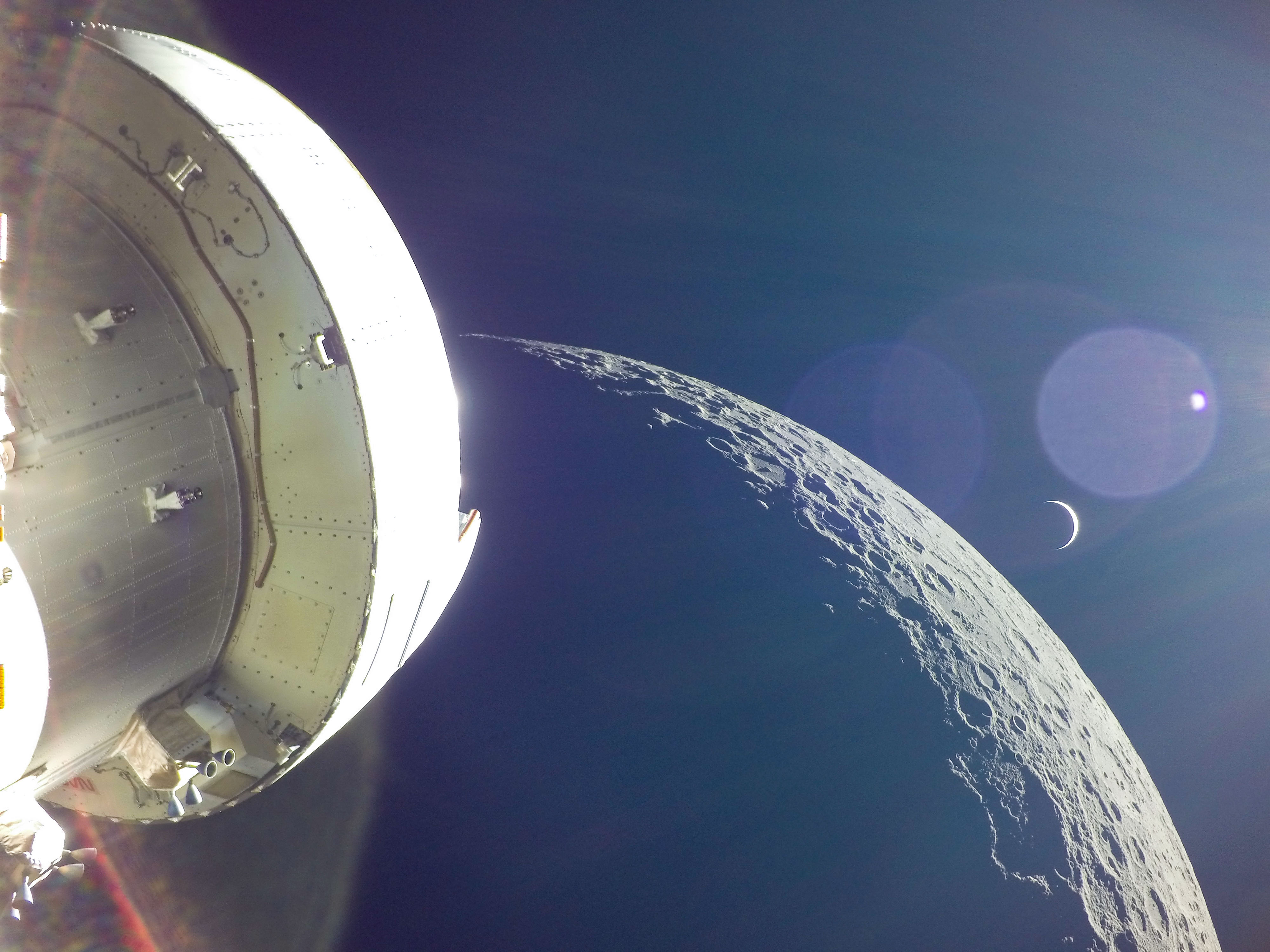 View of the Orion spacecraft, Moon, and Earth