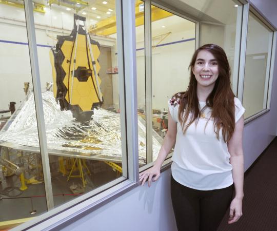 Nathalie Ouellette standing beside JWST
